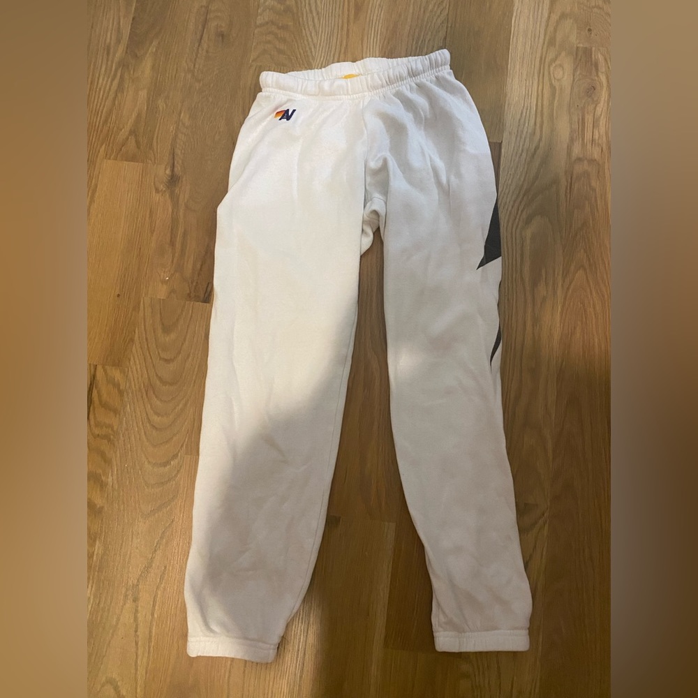 white aviator nation sweatpants with black lightning bolt